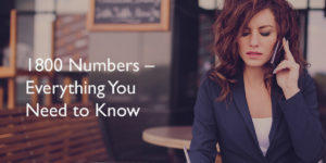 1800 1 Young business woman sitting at the table, writing in a notebook and talking on the phone